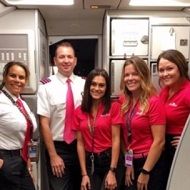 Gilliland as a flight attendant with fellow mates