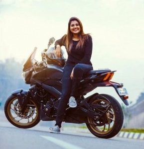 Alina Padikkal Wiki, Age (Bigg Boss) Height, Weight, Husband, Biography 8 Alina Padikkal with sports bike