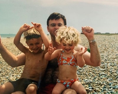 Camille pictured alongside her father and brother