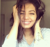 Disha Madan has a tattoo on her wrist