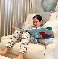 Eric Cowell - Biography, Age, Family & Facts about Simon Cowell's Son 9 Eric Cowell reading his favourite book