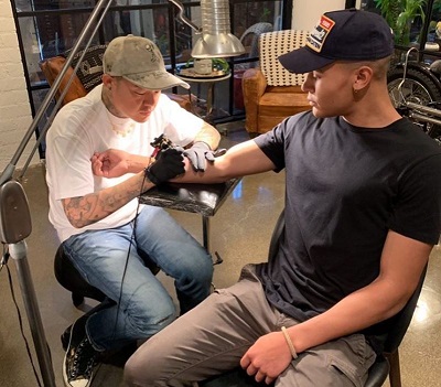 Truice Young Wiki, Age (Dr. Dre's son) Height, Weight, Biography & More 17 Truice Young getting his Tattoo