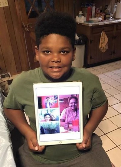 Ben Watkins with the picture of his mother and father