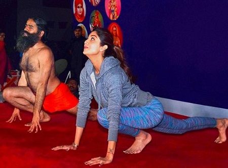 Shilpa Shetty doing yoga with Baba Ramdev