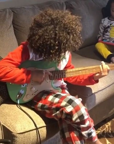 Lyon Daniels: Wiki, Age, Height, Family, Biography & More 16 Lyon Daniels playing Guitar
