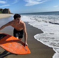 Hayes Grier: Age, Height, Girlfriend, Net worth, Family, Biography & More 8 Hayes Grier while surfing