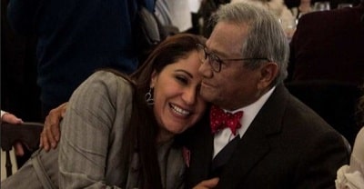 Laura Elena Villa hugging her husband.