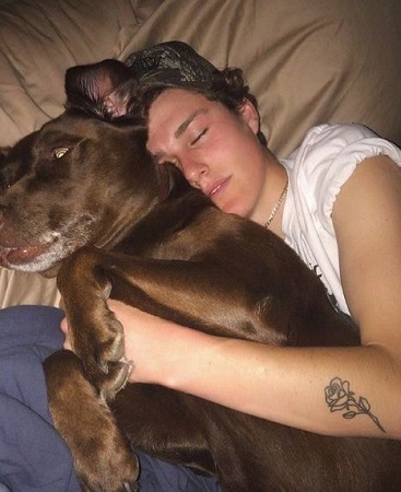 Ryland Storms with his pet dog