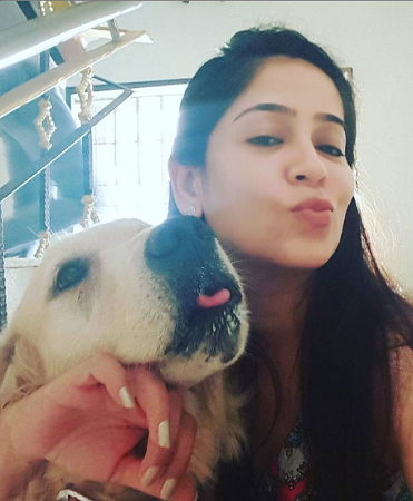 Lakshmi Vasudevan: Wiki, Age, Husband, Family, Movies, Height, Biography & More 20 Lakshmi Vasudevan with her pet dog