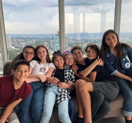 Rian McCririck: Wiki, Height, Age, Girlfriend, Net worth, Family, Biography & More 9 Rian McCririck enjoying with the cast of The Baby-Sitters Club