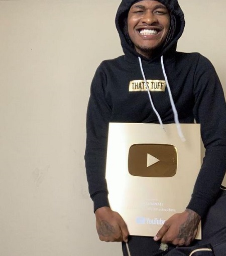 Solluminati: Age, Height, Girlfriend, Net worth, Biography & More 8 Solluminati looks elated as he holds his YouTube Play Button.