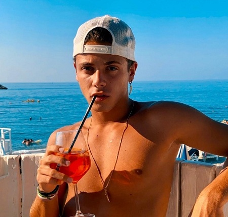 Christian Roberto drinks a red margarita