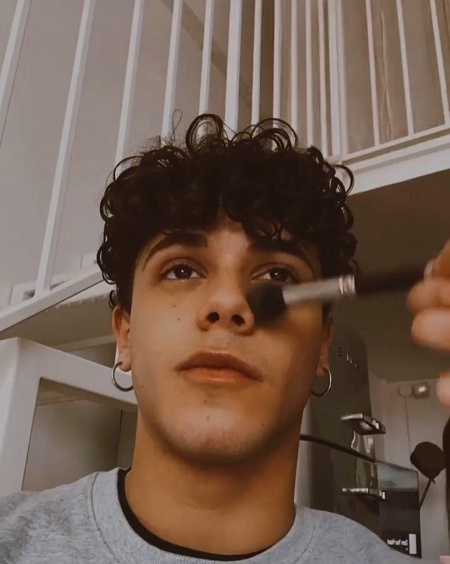 Christian Roberto is not afraid to wear makeup
