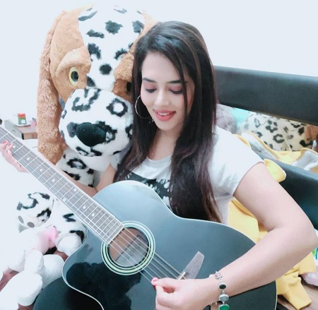 Remya Panicker plays guitar