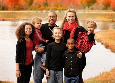 Kelly Tshibaka with her husband and kids