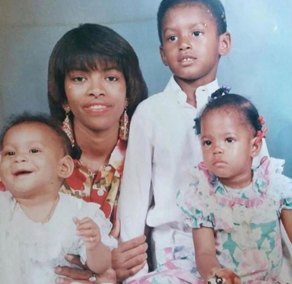 Vena E. snapped with her family in her childhood