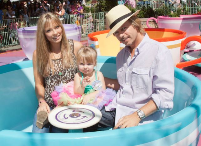 Harper Spade with her mother and father