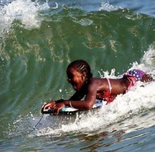 Who is Mercy James? Wiki, Biography & Facts About Madonna's Daughter 13 Mercy James during enjoying surfing