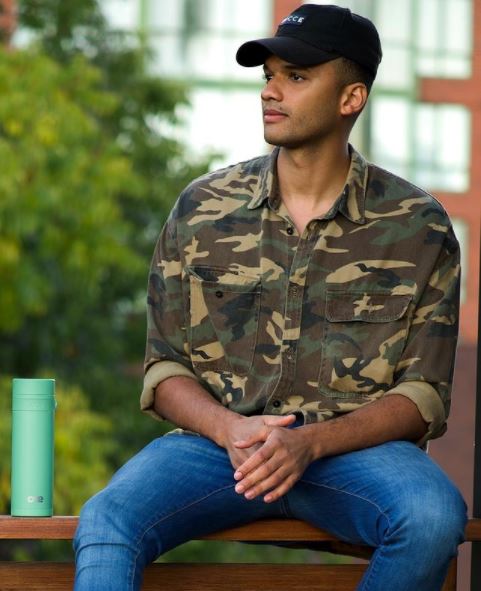 Petrice Jones poses with his One Movement's water bottle