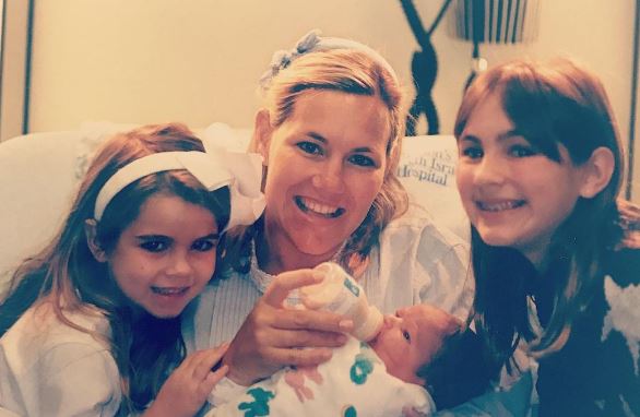 An old photo of Taylor with her mother and sisters