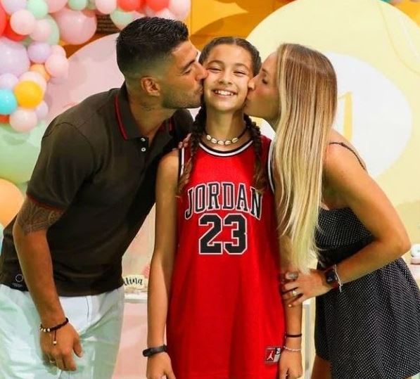 Delfina with her parents