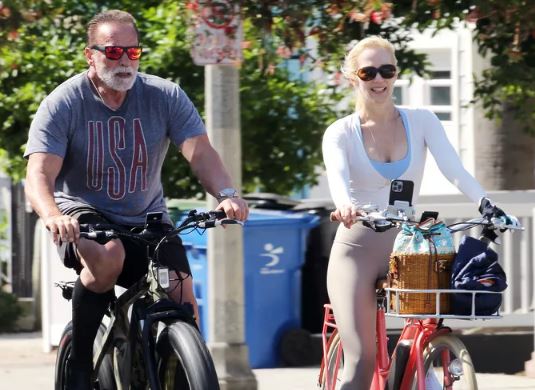 Heather Milligan and Arnold Schwarzenegger enjoys bike riding