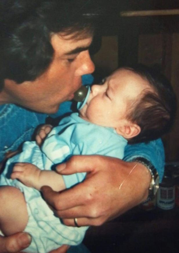 Childhood photo of Cody with his father